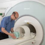 Scientist calibrating an MRI Scanner