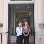 Two females standing in front of the Royal Academy of Engineering