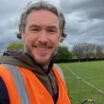 Full face photo of me in a park wearing an orange hi-viz vest.