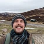 Matthew Wadge standing in front of the Spital of Glen Shee in Scotland, which is a road that travels through Mountains on the way to Balmoral Castle.