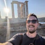 Dr Matthew Wadge standing in front of the Temple of Poseidon in Athens, Greece.