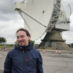 Me next to the large, 25 meters in diameter, radar dish.