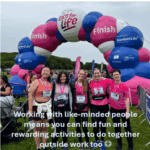 Group of people standing at the finish line of a race