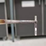 Me holding up a prepared glass tube for micro pyrolysis (burning some tree bark in the absence of oxygen, to make an oil for various applications)