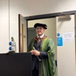 A picture of me earlier this year, about my PhD graduation at Leeds University. I went to see my friends to see how they were, but I was still wearing the silly hat and robe.