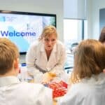 Lindsay extracting DNA from a strawberry at a family and friends event