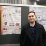 Me at a conference in Sweden in 2019 presenting a poster about my research at that point