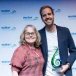 Chief Exc of Water NZ presenting award to Alex at conference awards night