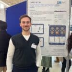 Me presenting a poster at a conference